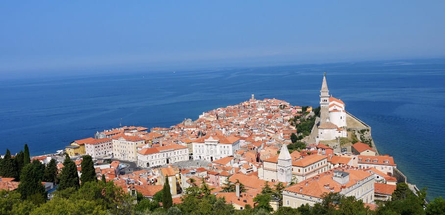 A beautiful aerial view of the coastal city Piran in Slovenia. In the background the sea.