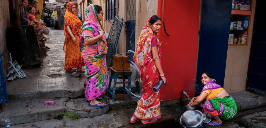 Indian women workers in an alley